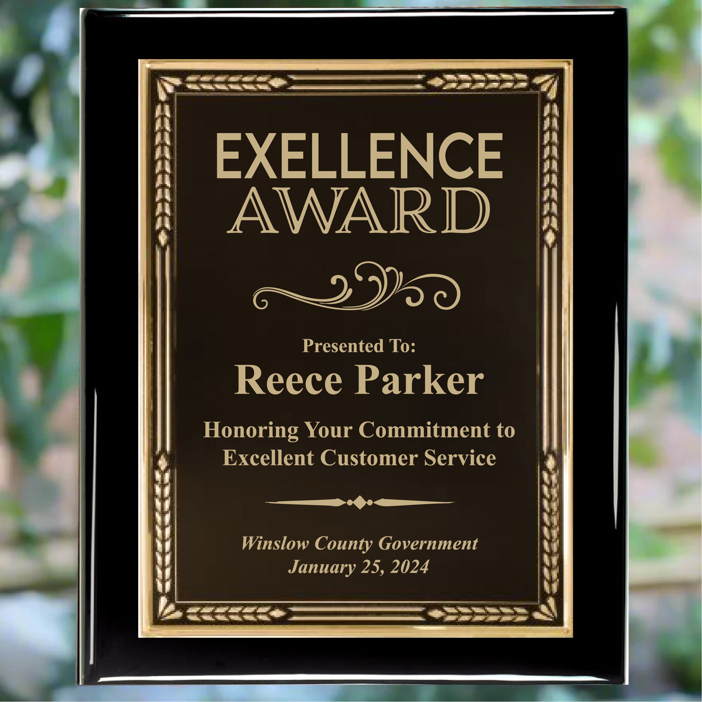 Personalized black piano finish award plaque with black plate with gold trim, featuring custom text for a commitment to excellent customer engraving.