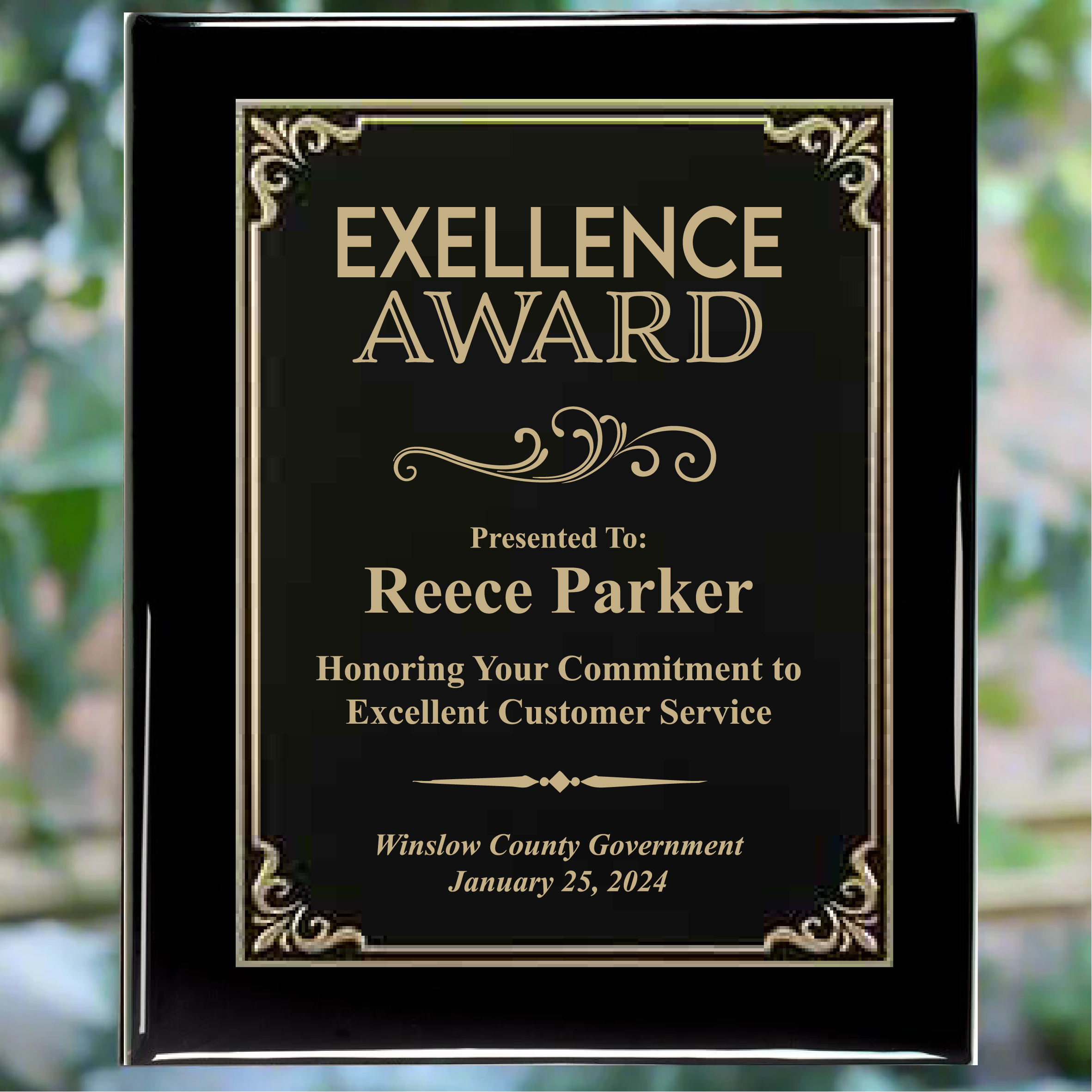 Personalized black piano finish award plaque with black plate with gold trim, featuring custom text for a commitment to excellent customer engraving.
