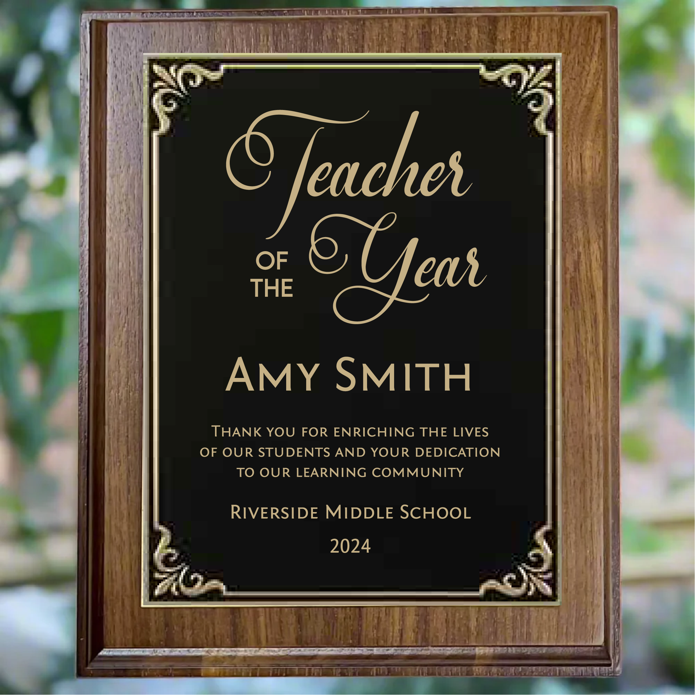 Personalized walnut finish award plaque with black plate with gold trim, featuring custom engraving.