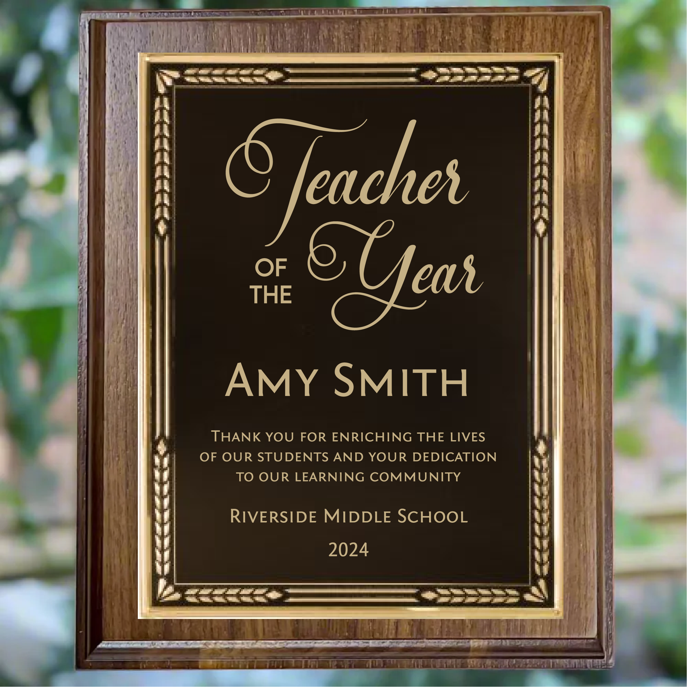 Personalized walnut finish award plaque with black plate with gold trim, featuring custom engraving.